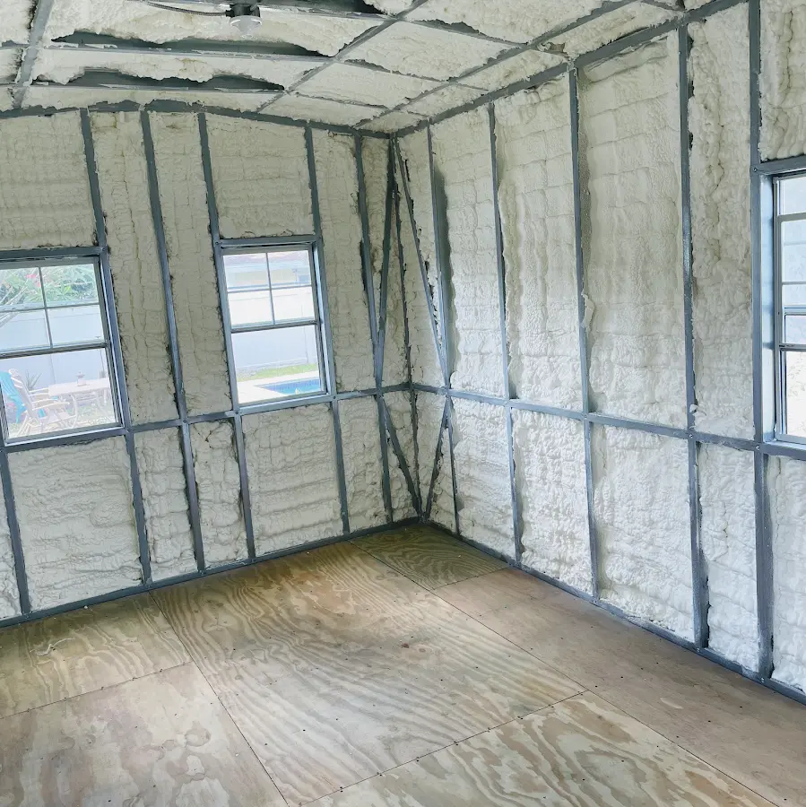Closed-cell spray foam insulation applied to wall cavities in a residential project in Woodridge